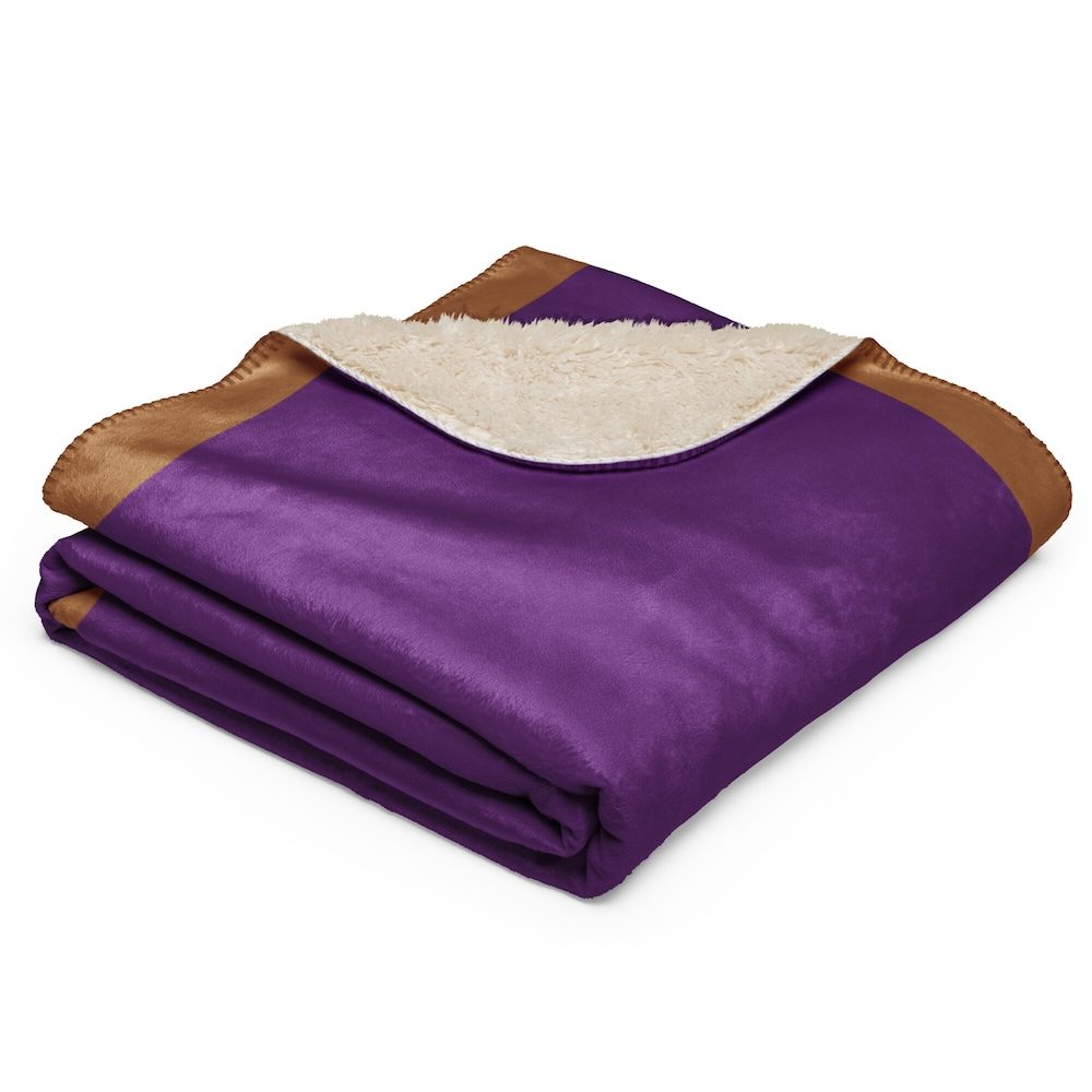 Folded blanket showing the purple face and cream sherpa lining